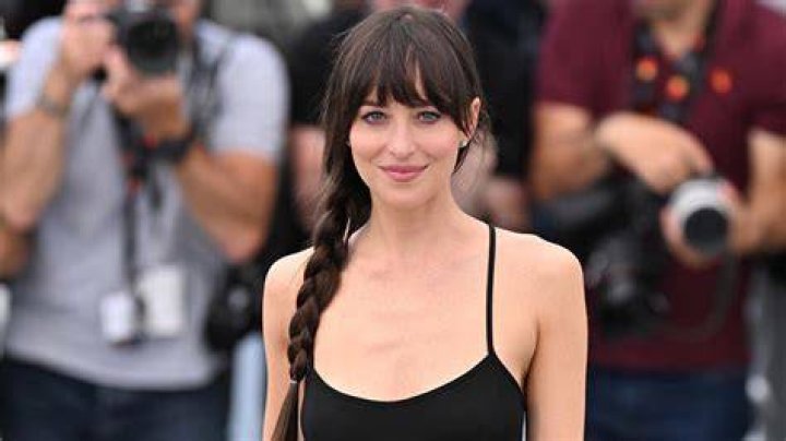 No fuss: Dakota kept her beach style minimalist and accessorized with a low-key black necklace