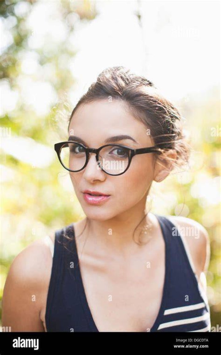 woman wearing glasses and wearing a beanie hat. winter avatar character